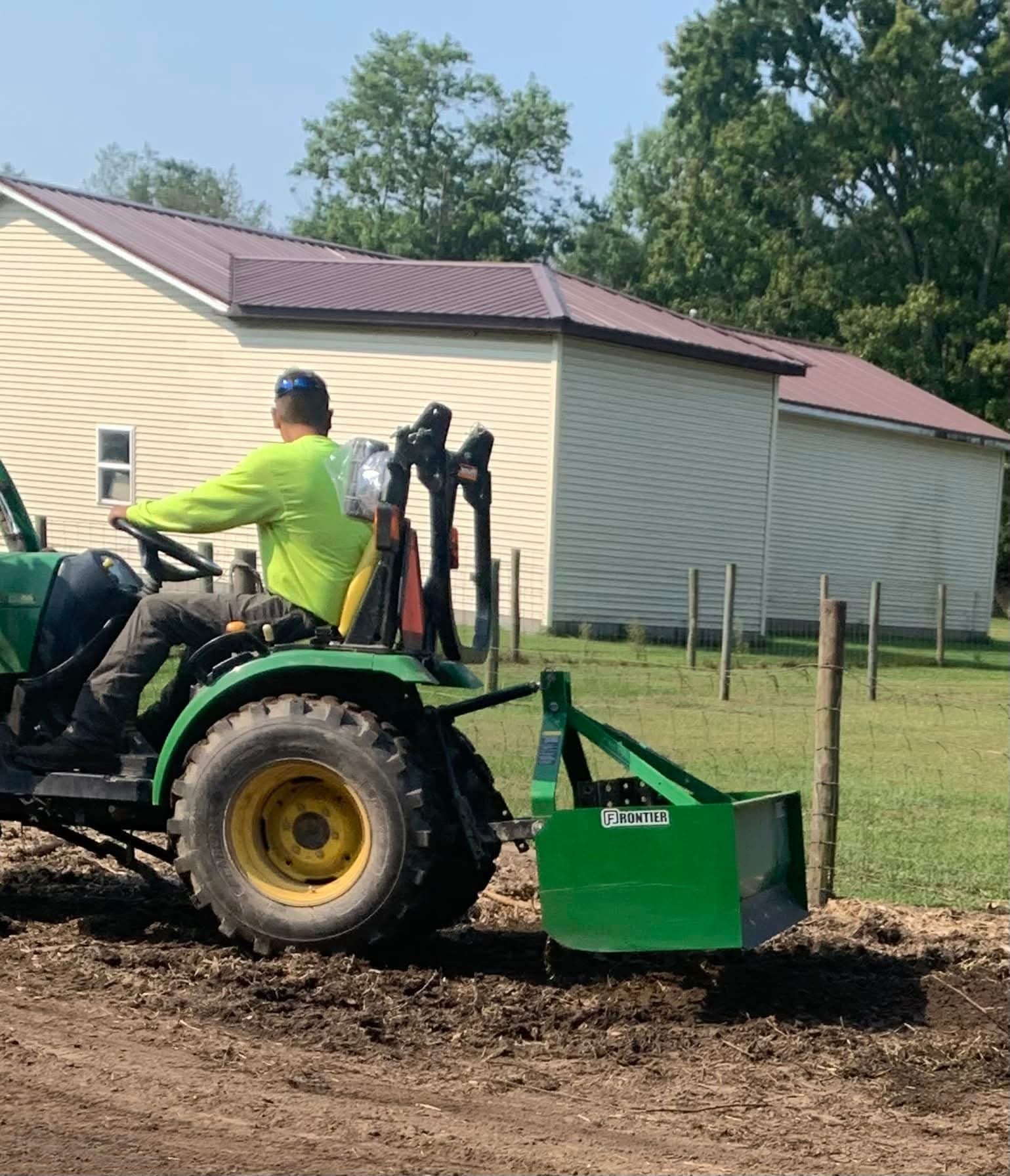 Grading with a box blade on a John Deere tractor
